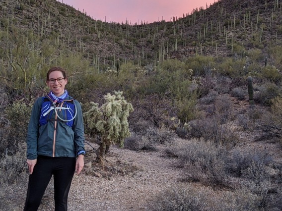 Caitlyn Hall running at sunset in Tucson Mountain Park
