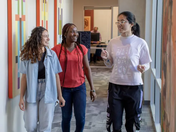 Students walking and walking in Franke Honors College offices