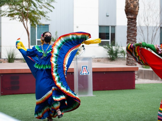 Folklorico dancers perform in the Honors Village courtyard