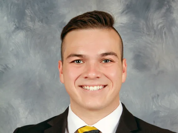 Person in front of grey marbled background