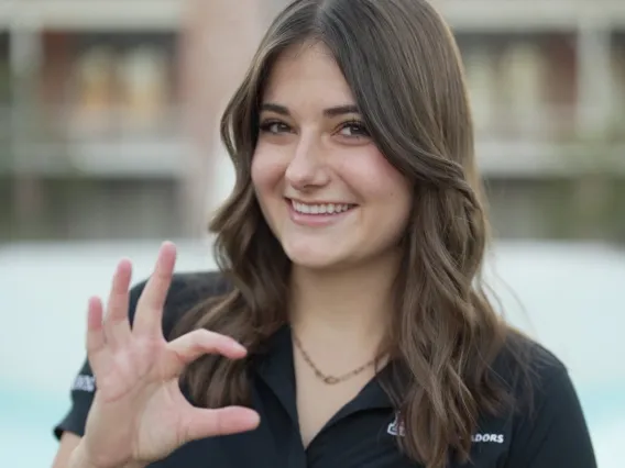 headshot of student with old main background