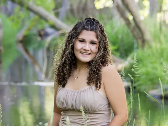 student headshot green grass background 