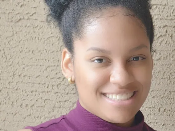 Headshot of Makayla in purple top 