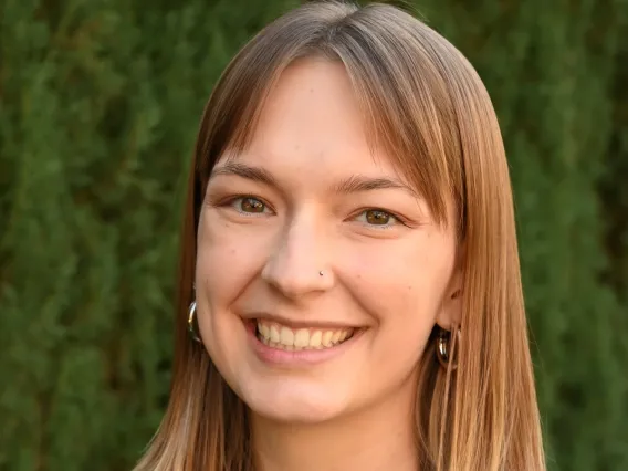 woman headshot with green background