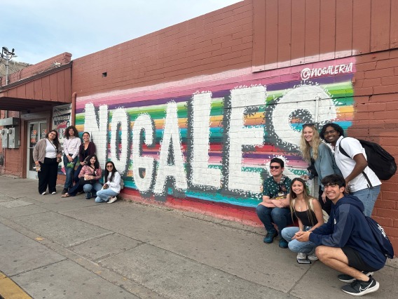 students in front of nogales sign