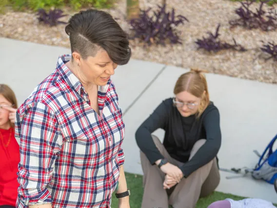 Jennie McStotts with her class outside in the Honors Village Courtyard