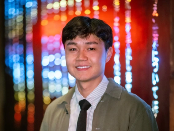 headshot of person with red blue background