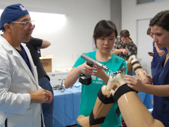 Students working on prosthetic knee 