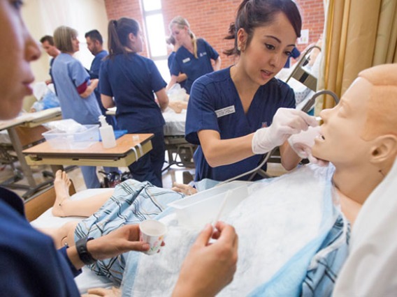 Student Nursing working practicing with a dummy