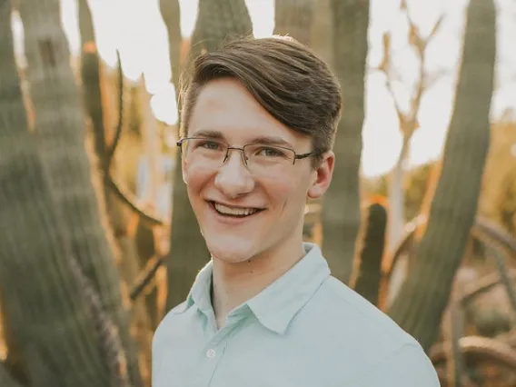 Udall Scholarship recipient Kyle Kline with ocotillo cactus in background