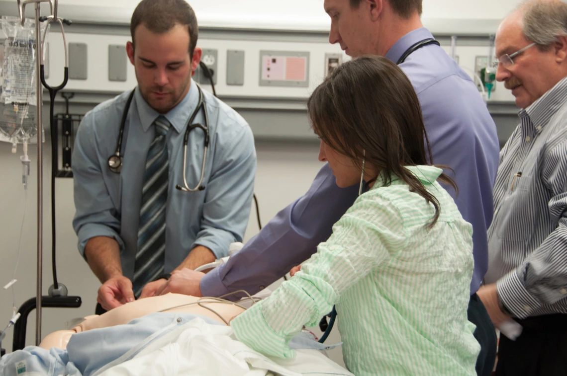 Medical Students with practice dummy