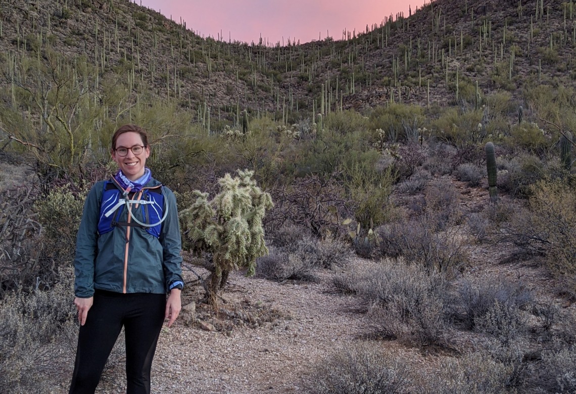 Caitlyn Hall running at sunset in Tucson Mountain Park