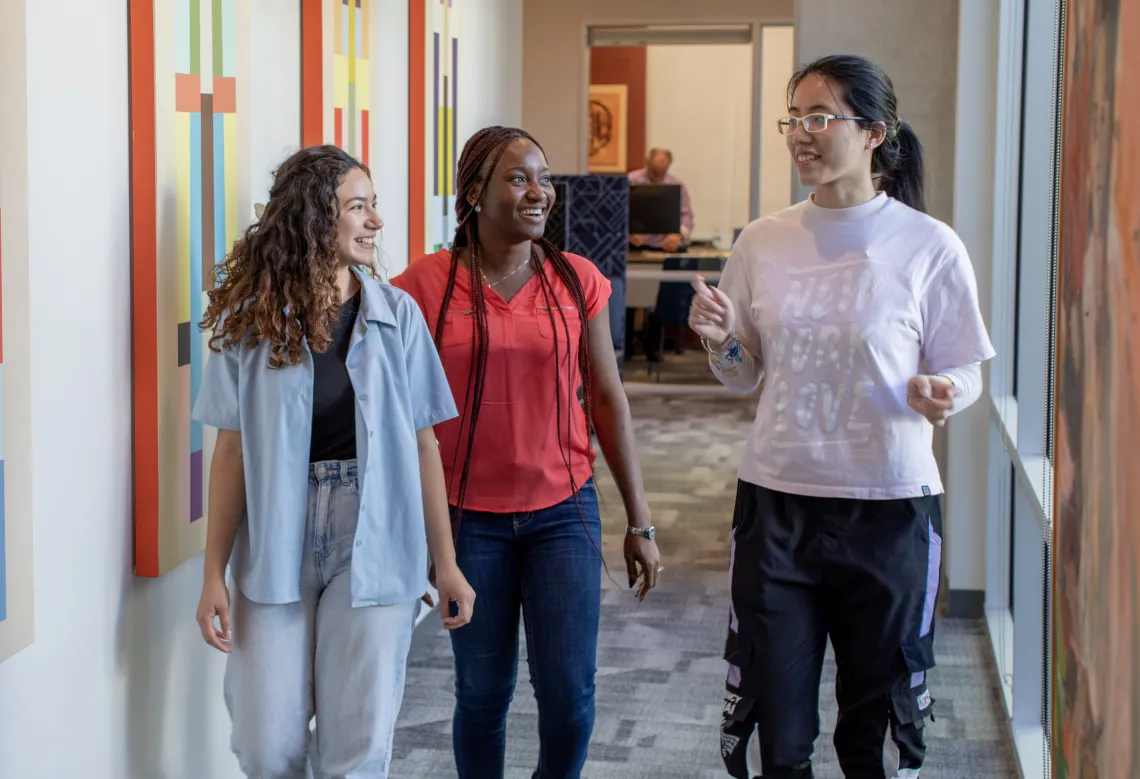 Students walking and walking in Franke Honors College offices