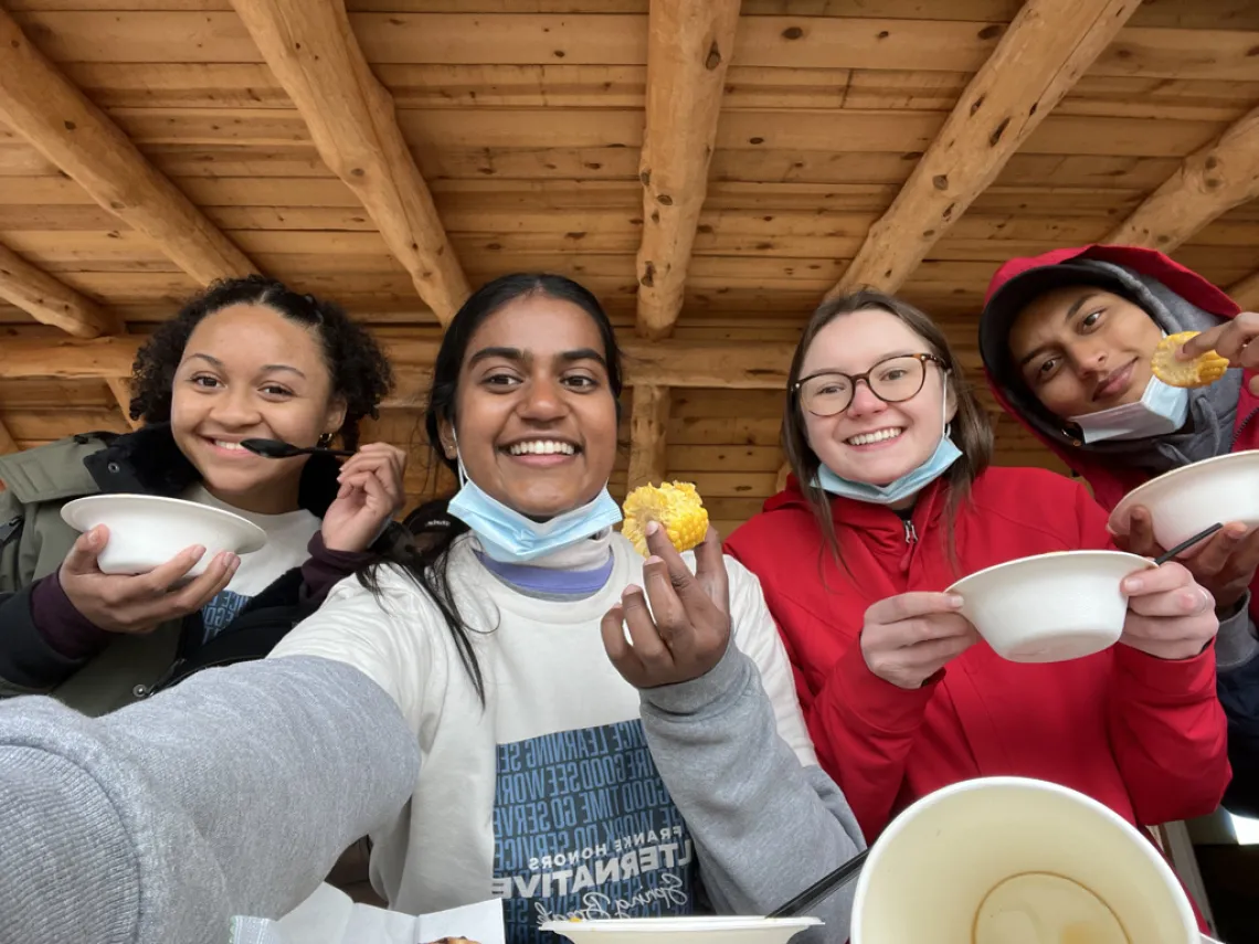 Students sharing a meal on the 2022 HASB Whitewater Trip