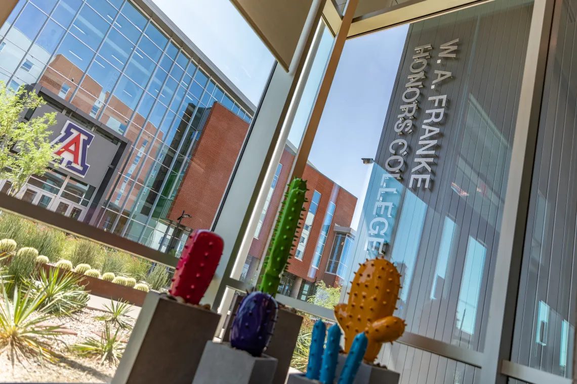 An interior shot of the Honors Village looking out at the building entrance. 