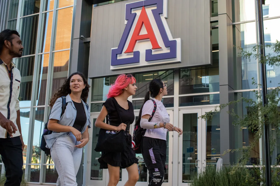 students walking in front of north rec center with block A in the background