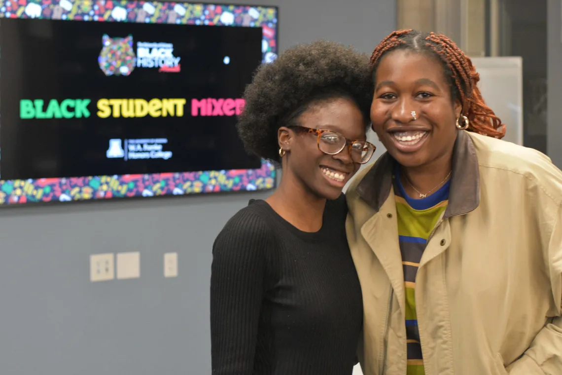 Two students at the Black Student Mixer in 2023.