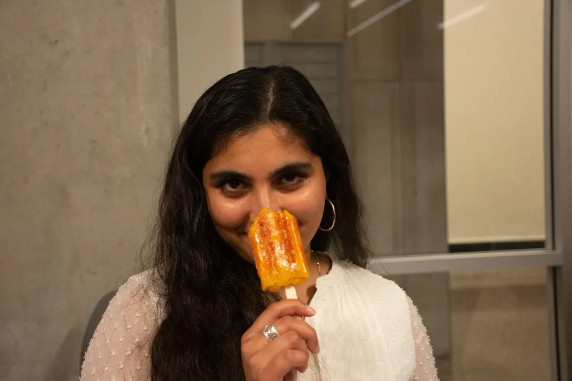 Student eating a popsicle