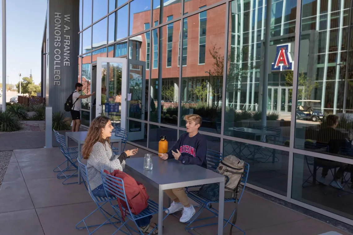 Students talking outside Honors Village