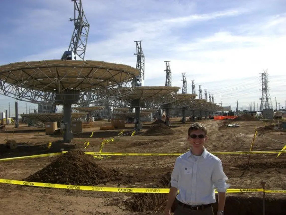 person standing in front of solar field