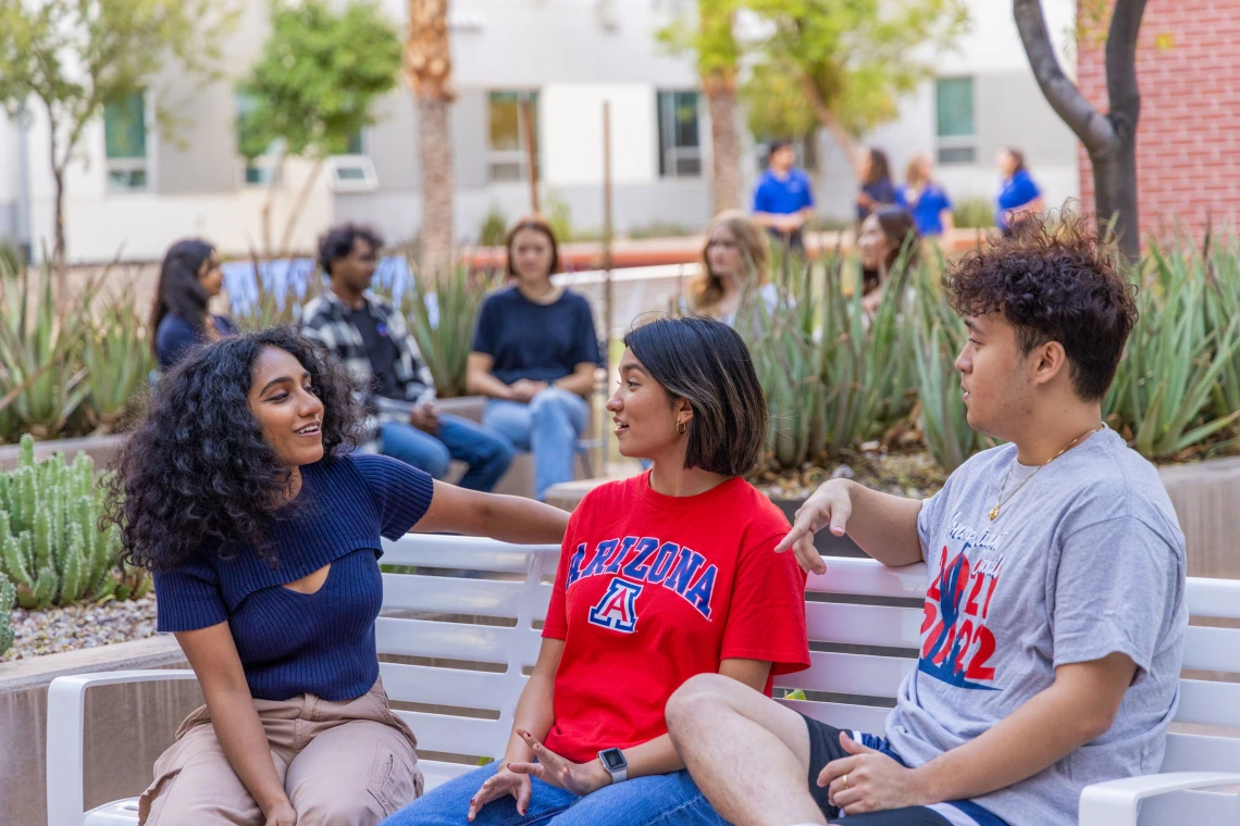 Honors Student Council students talking in the Honors Village Courtyard