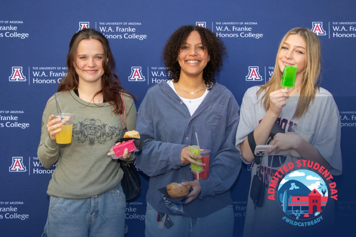 UofA Ladies in front of Step and Repeat