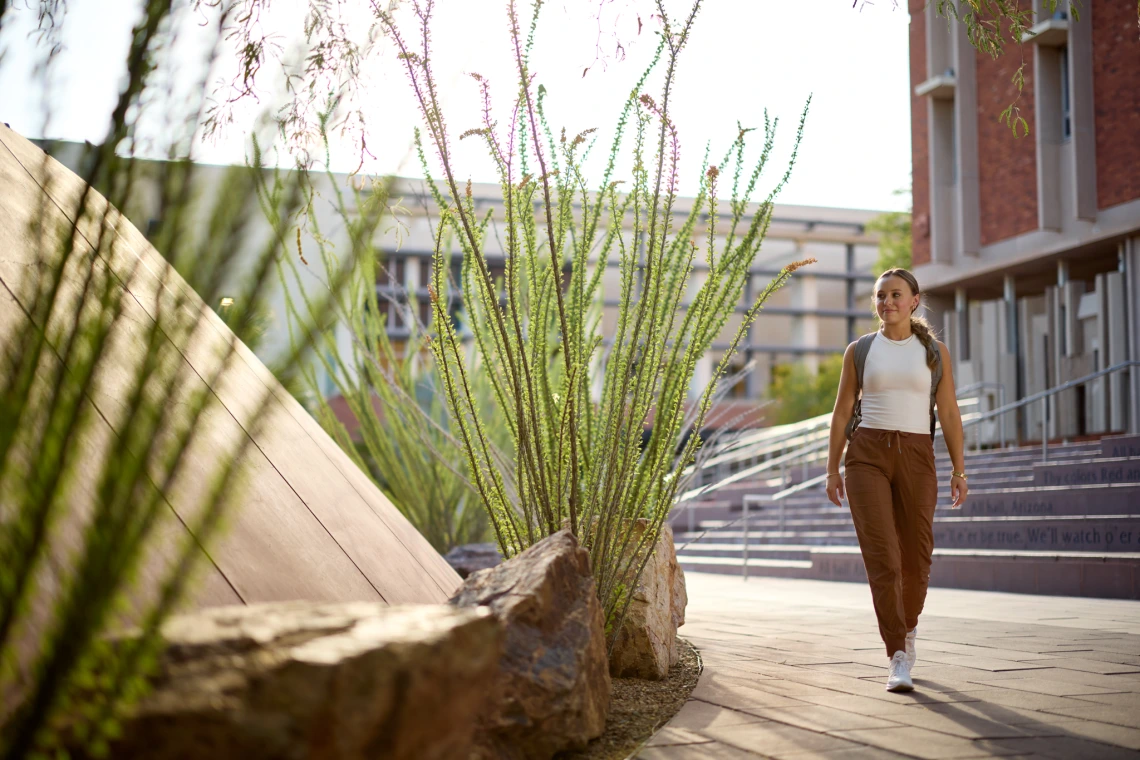 Student walking by admin building