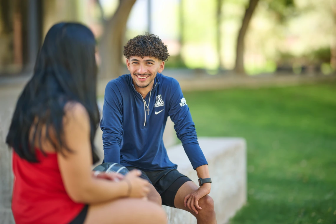 Two students talking outside