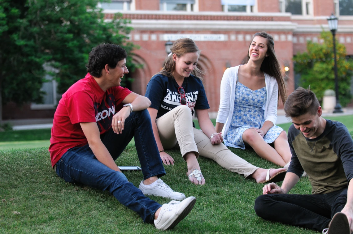 Students sitting on the grass