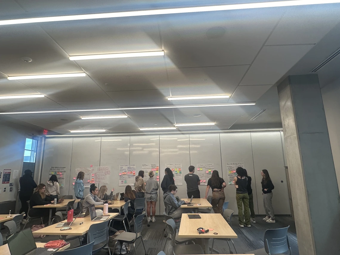 students writing on white board