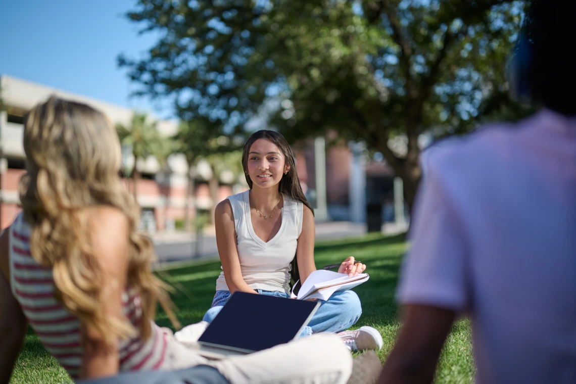 Student talking with friends on campus