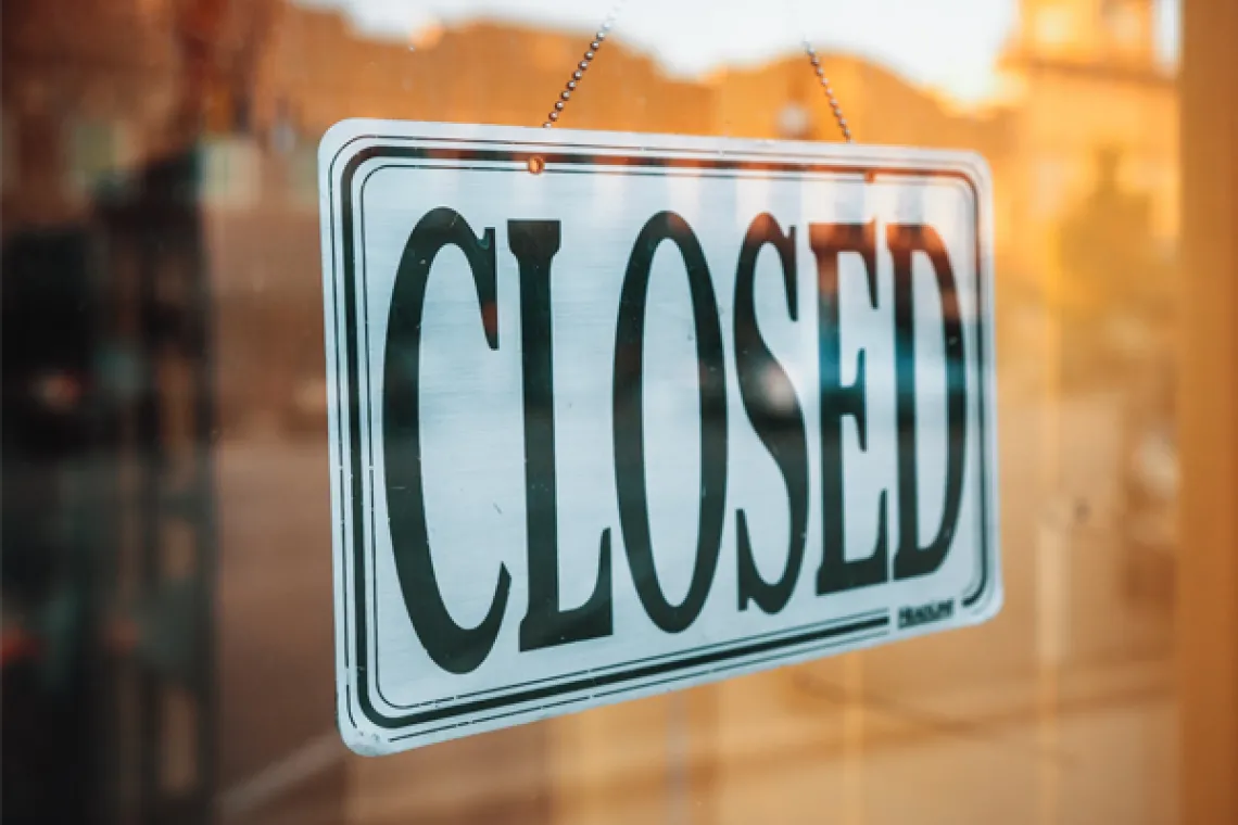 Door sign reading, "Closed"