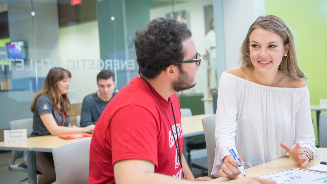 Students sitting at a table deep in discussion