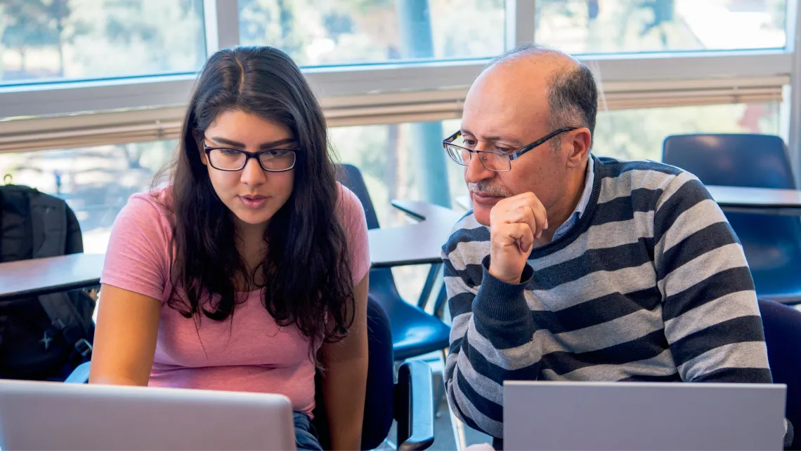 Student interacting with faculty