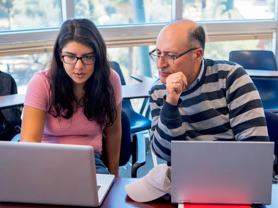 Student interacting with faculty