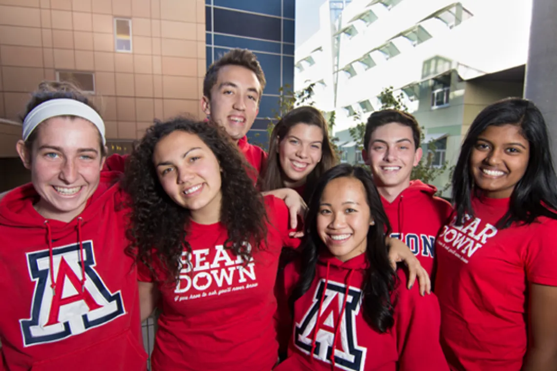 Group of seven Honors College students wearing UA gear.