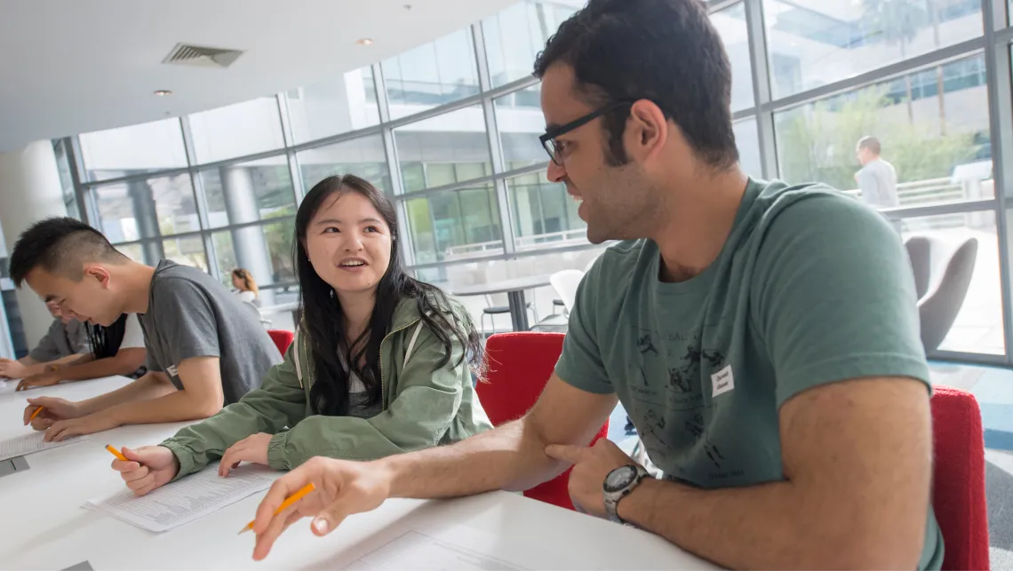 Students sitting at a table deep in discussion