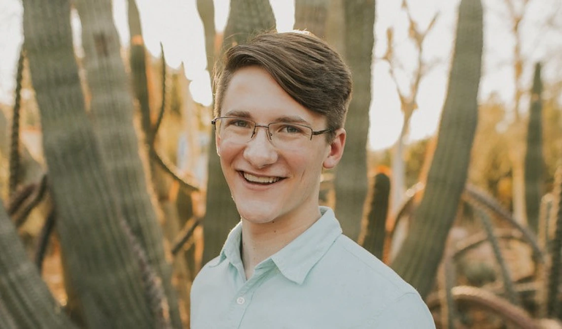 Udall Scholarship recipient Kyle Kline with ocotillo cactus in background