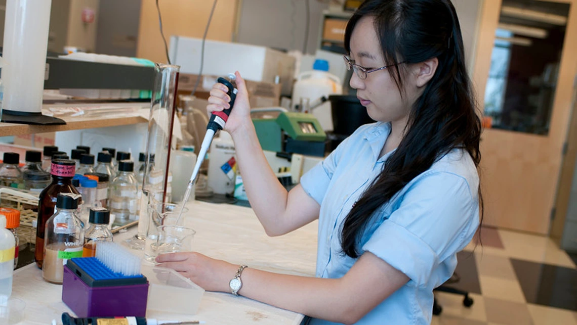 Female student working a lab