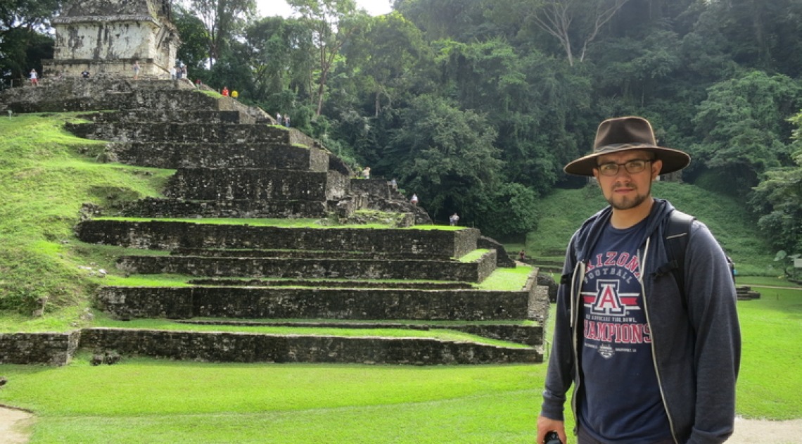 Photo of Anthony Polanco beside Mayan temple Palenque