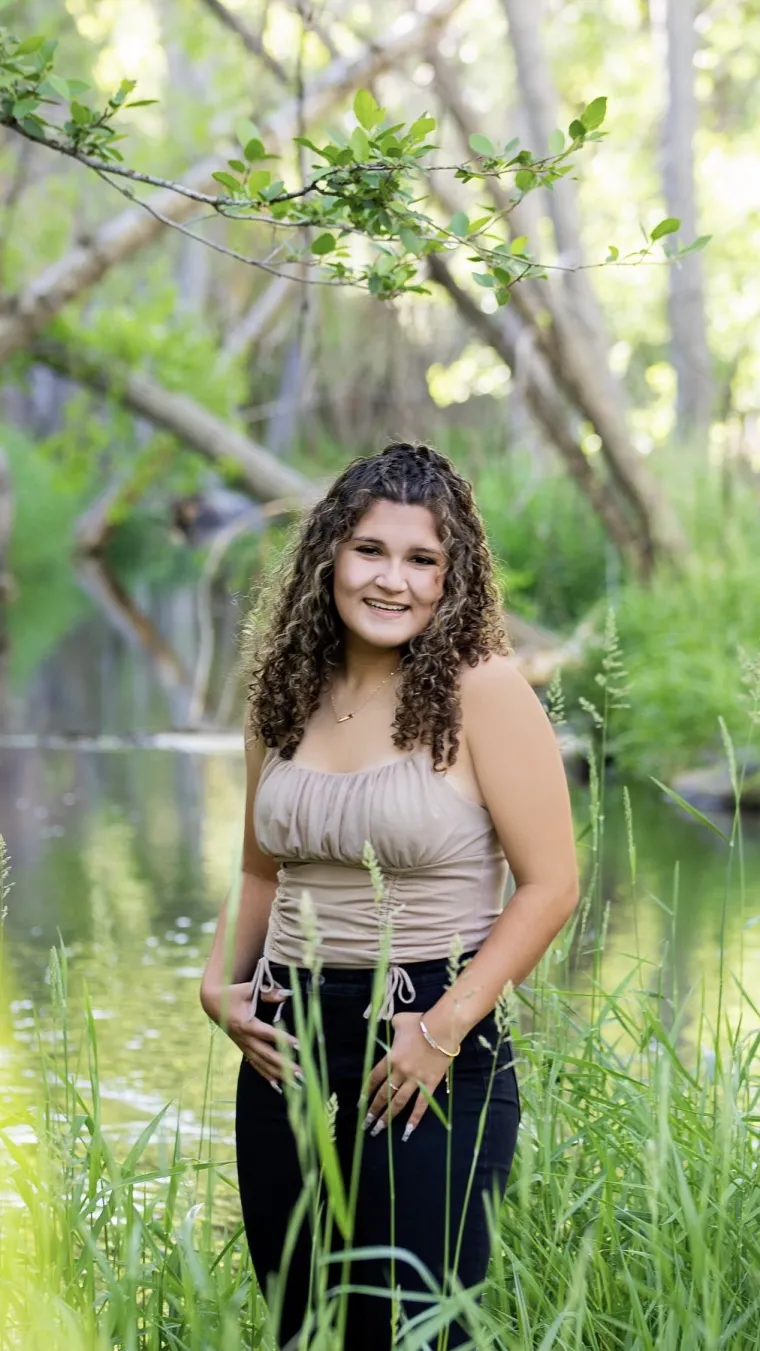 student headshot green grass background 