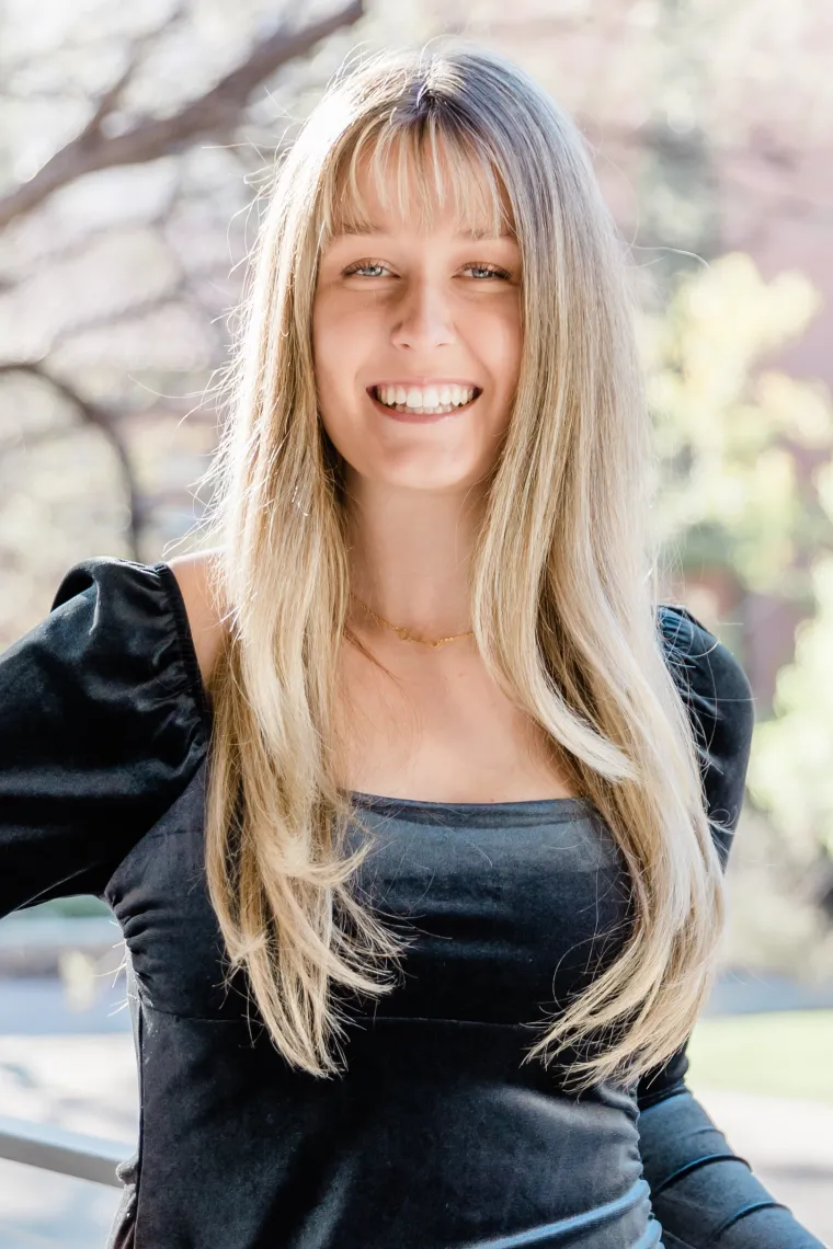 student headshot with tree background