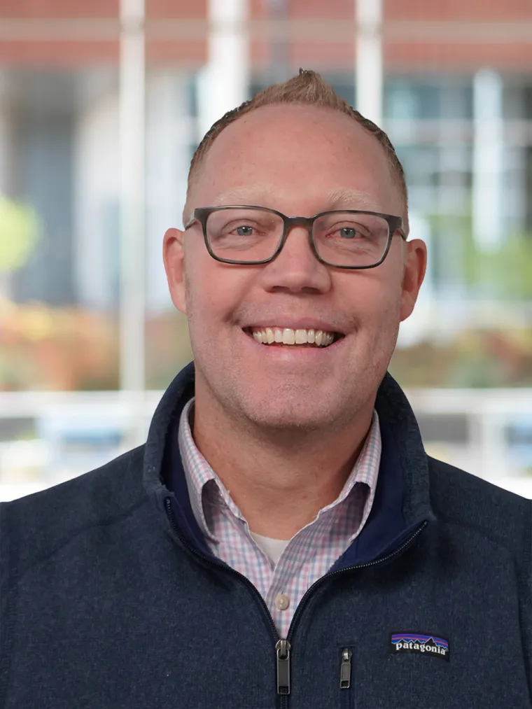 Derick Maggard Headshot, caucasian male with glasses