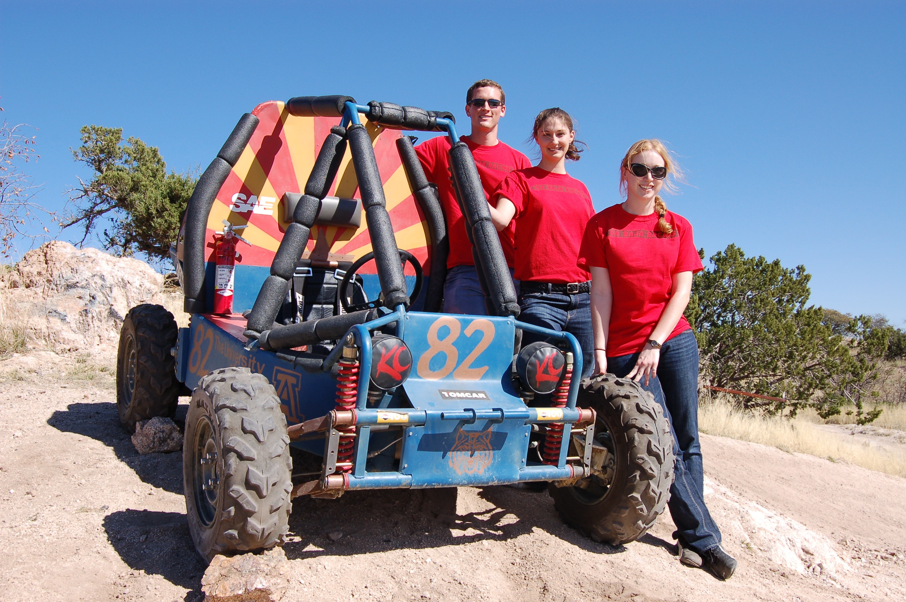 Engineering students with the baja racer they built