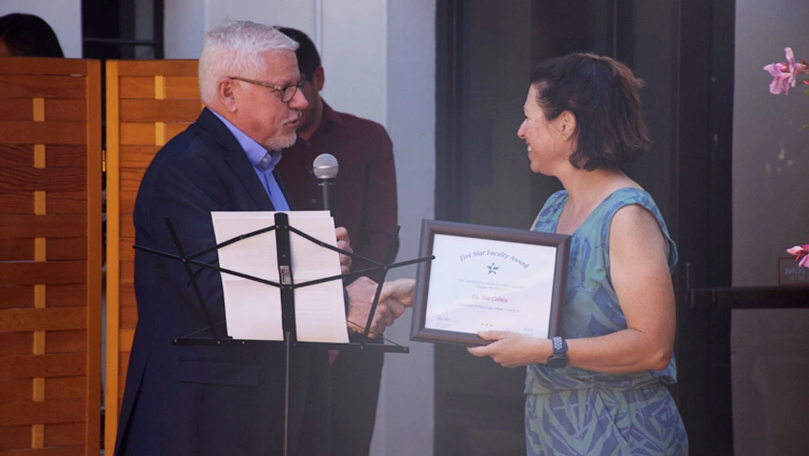 Dr Terry Hunt giving out the Five Star Faculty Award