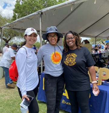Dr. Cheree Meeks (right) with students Khadija Sawayz (left) and Lauryn White (middle) at Tucson's annual Juneteenth Festival.