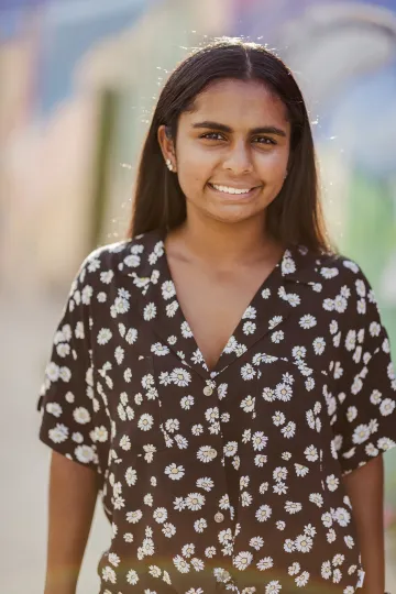 solo person pictured in floral attire blurred background