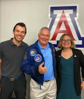 three people smiling block A background