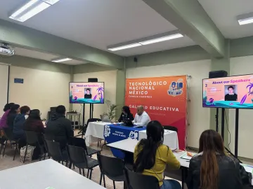 students sitting in classroom having conversation