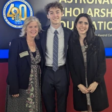 three people smiling at camera background reading astronaut scholarship foundation